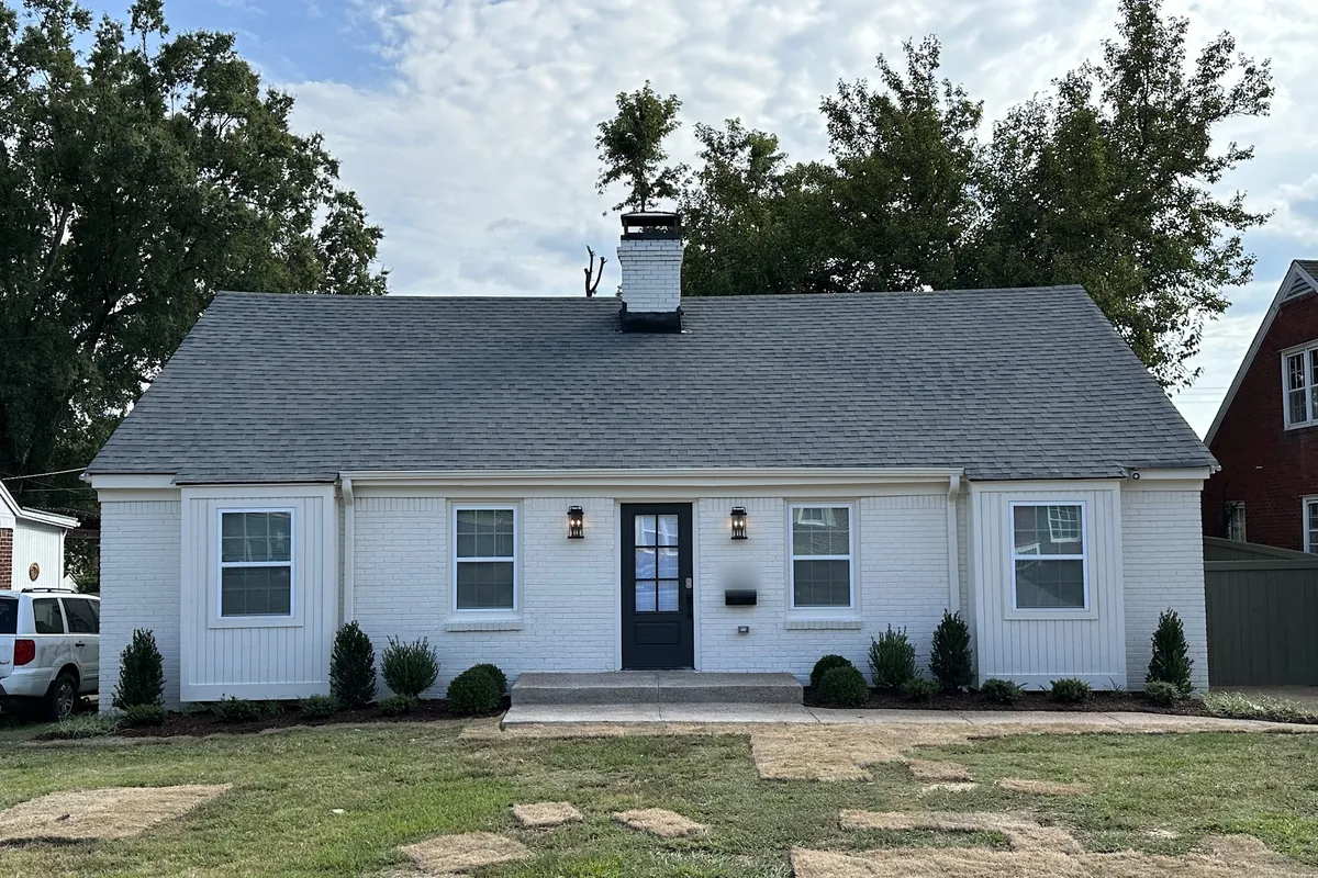 Front after renovation, Brick house rebuilt after a fire