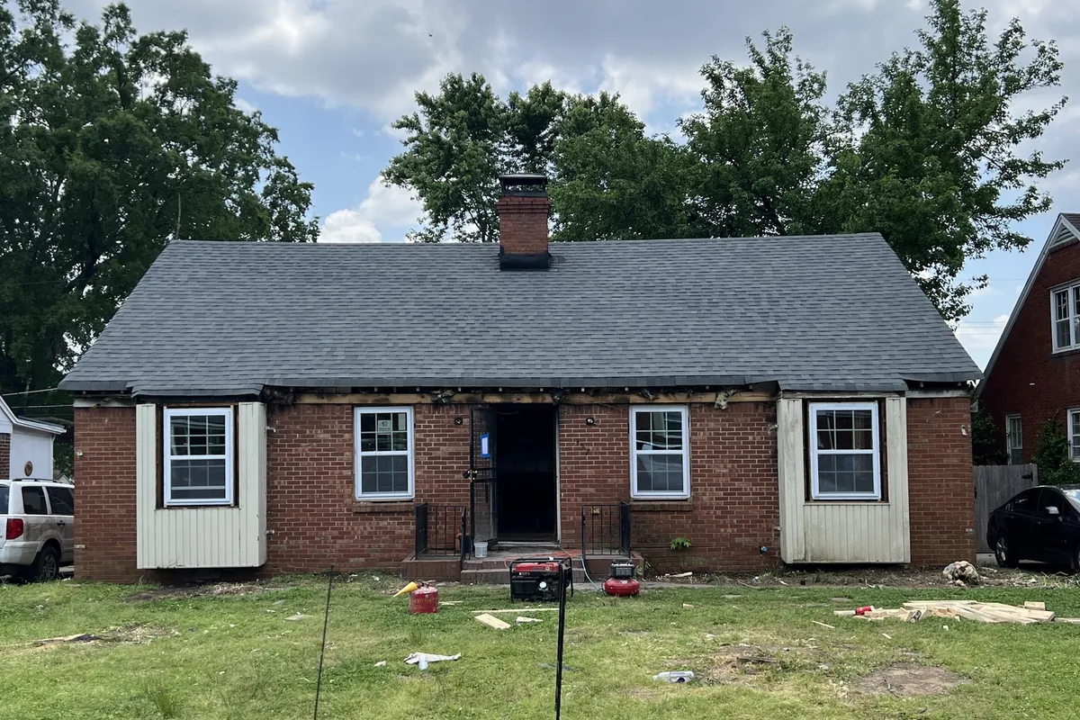 Front before renovation, Brick house rebuilt after a fire